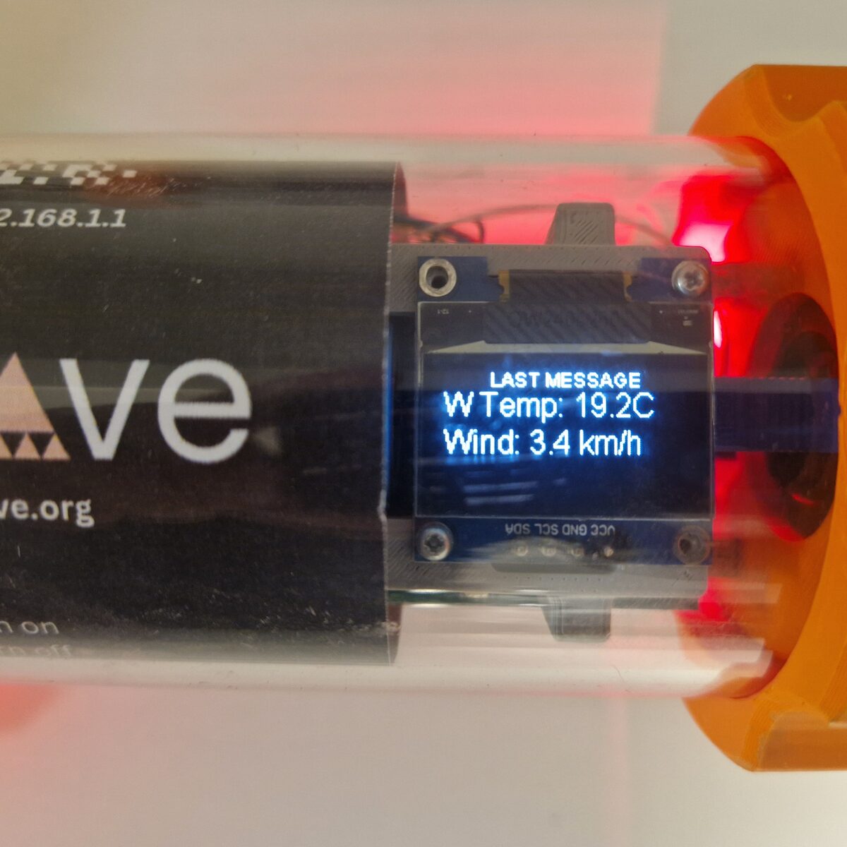 Close-up of a node’s message display showing the last message: outdoor temperature 19.2 °C and wind 3.4 km/h.